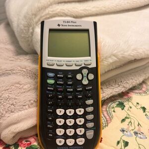 Texas Instruments TI-84 Plus with Black and Orange Accents